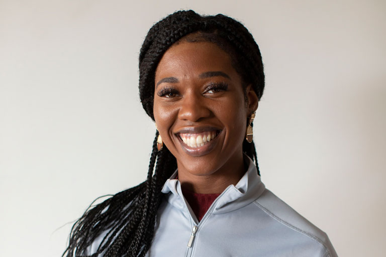 Young female care partner smiling