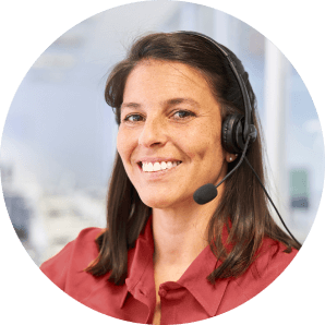 Photo of a customer service representative, smiling and wearing a headset